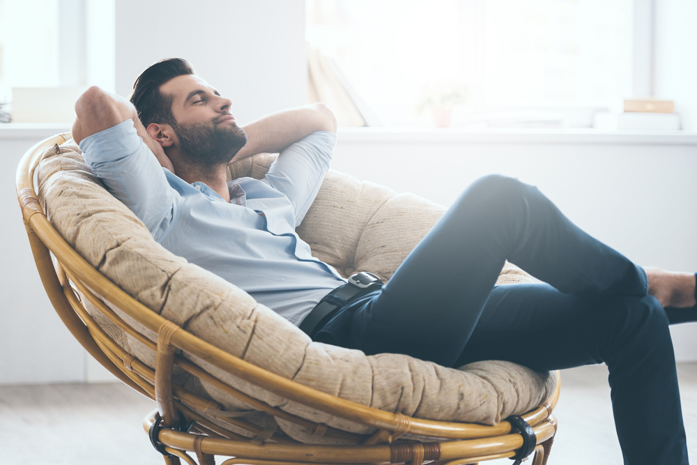 man resting on couch